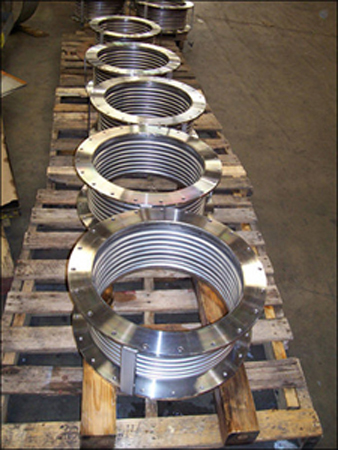 Single tied expansion joint fabricated from stainless steel